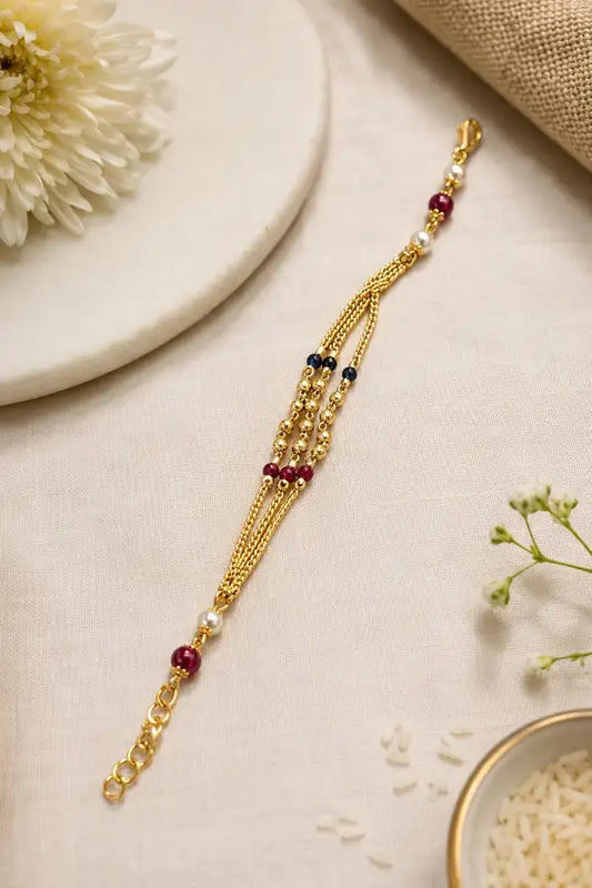Premium Gold-Plated Bhabhi Rakhi with Pearl & Ruby Beads