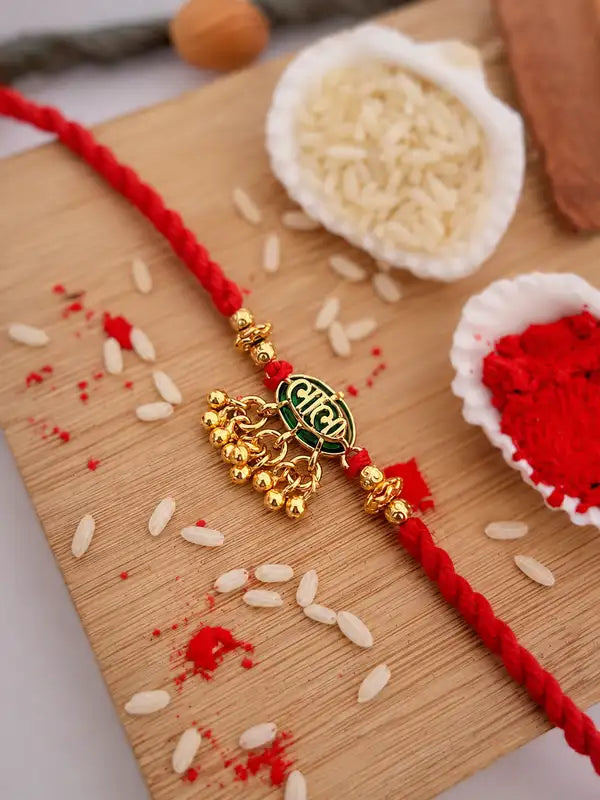 Traditional Gold-Plated Designer Bhabhi Rakhi with Red Mauli Thread