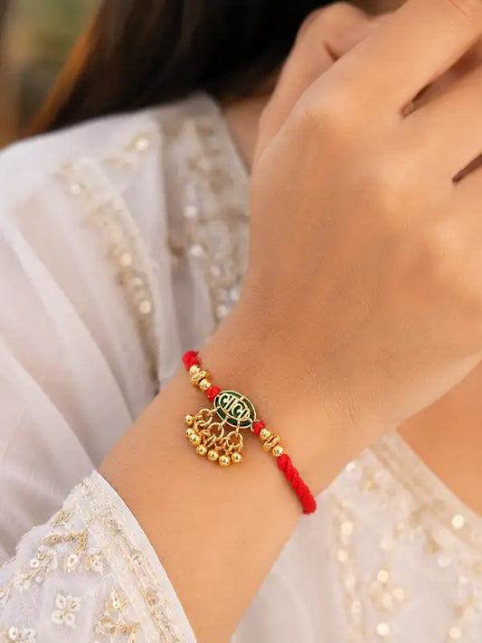 Traditional Gold-Plated Designer Bhabhi Rakhi with Red Mauli Thread